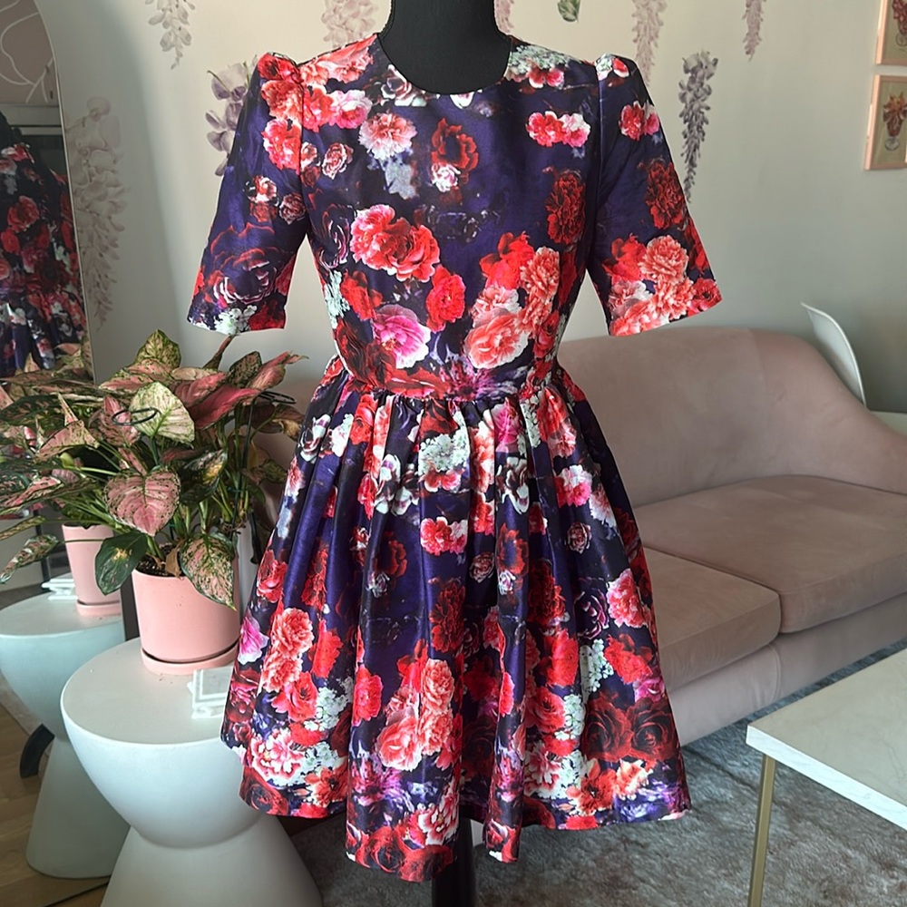 Chicwish purple floral mini dress with 3/4 sleeves.